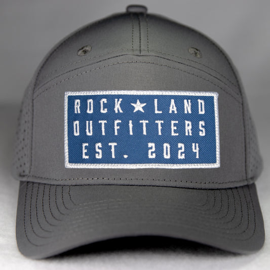 Rock Land Outfitters Blue Logo Patch On A 7 Panel Water Repellent Gray Hat