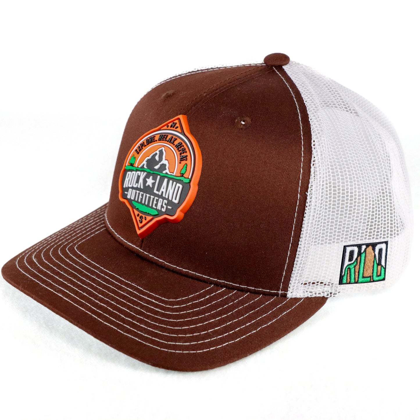 Rock Land Outfitters PVC Logo Patch On A Brown And White Trucker Hat