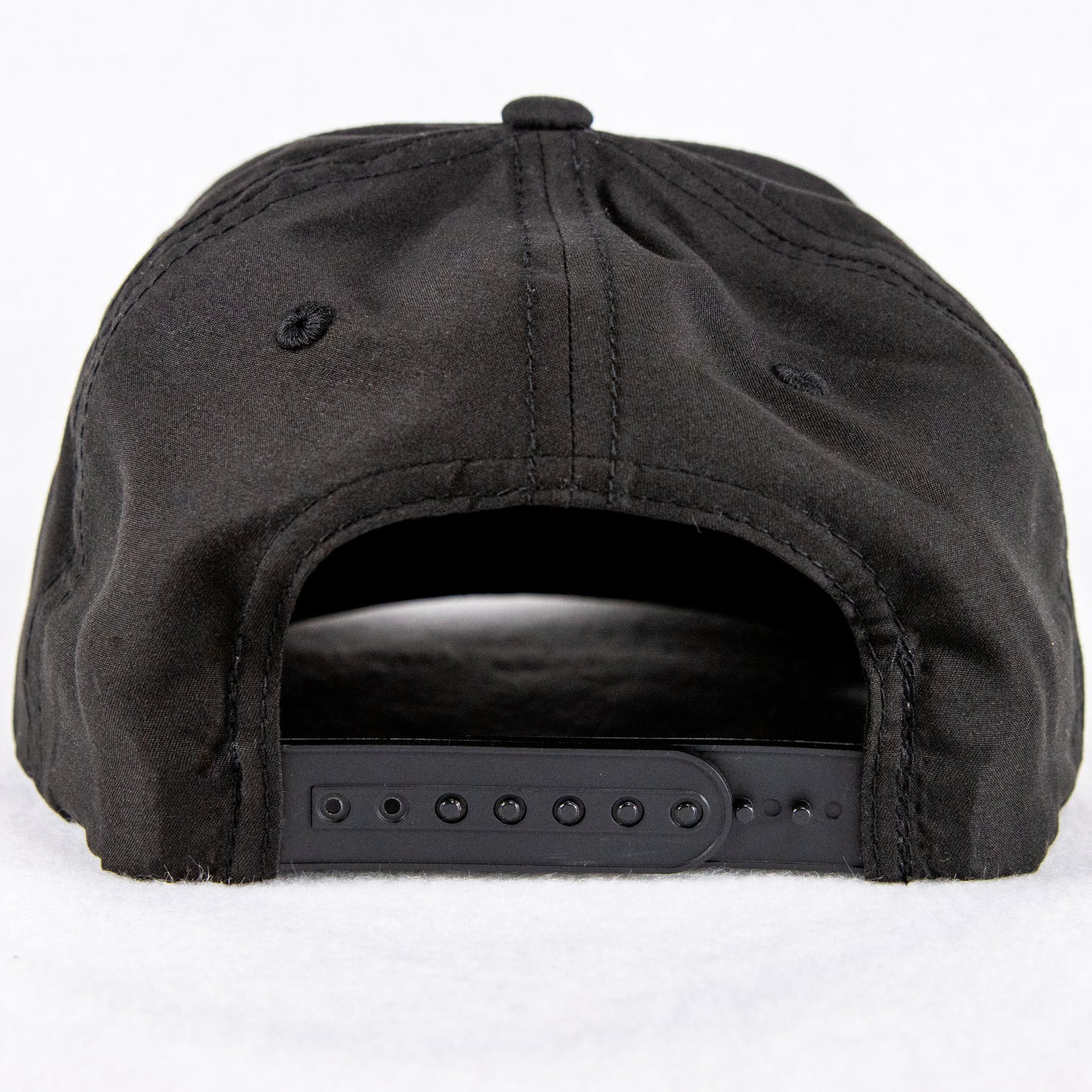 Rock Land Outfitters Blue Logo Patch On A Black Hat